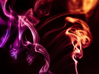 Abstract representation of fluid human motion in a dark studio.